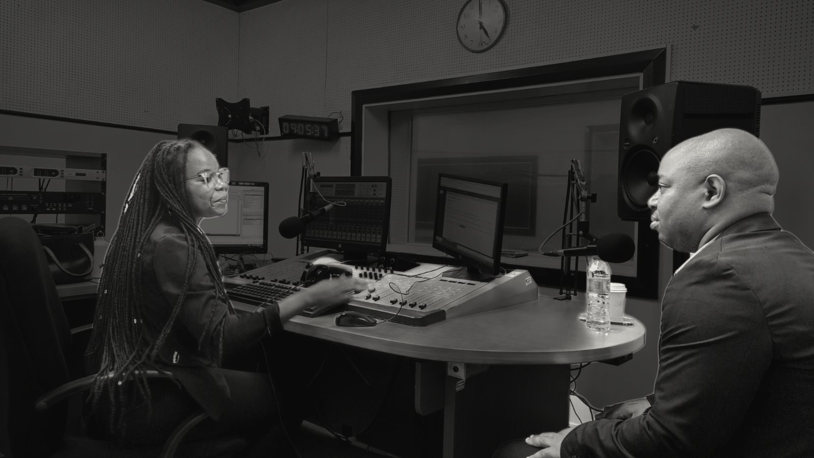 Frank Tsuro in conversation with the presenter in a radio studio in Maputo.